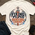 Fixing Pipes Serving Christ T-Shirt